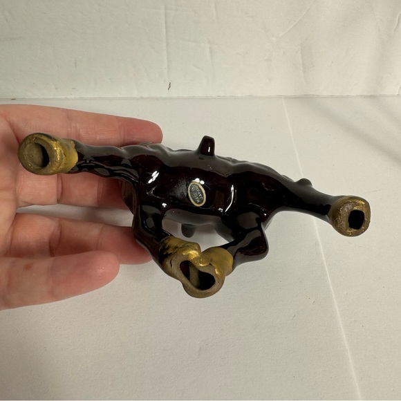 Vintage small brown ceramic horse figurine featuring gold trim and a red saddle. - Picture 9 of 10